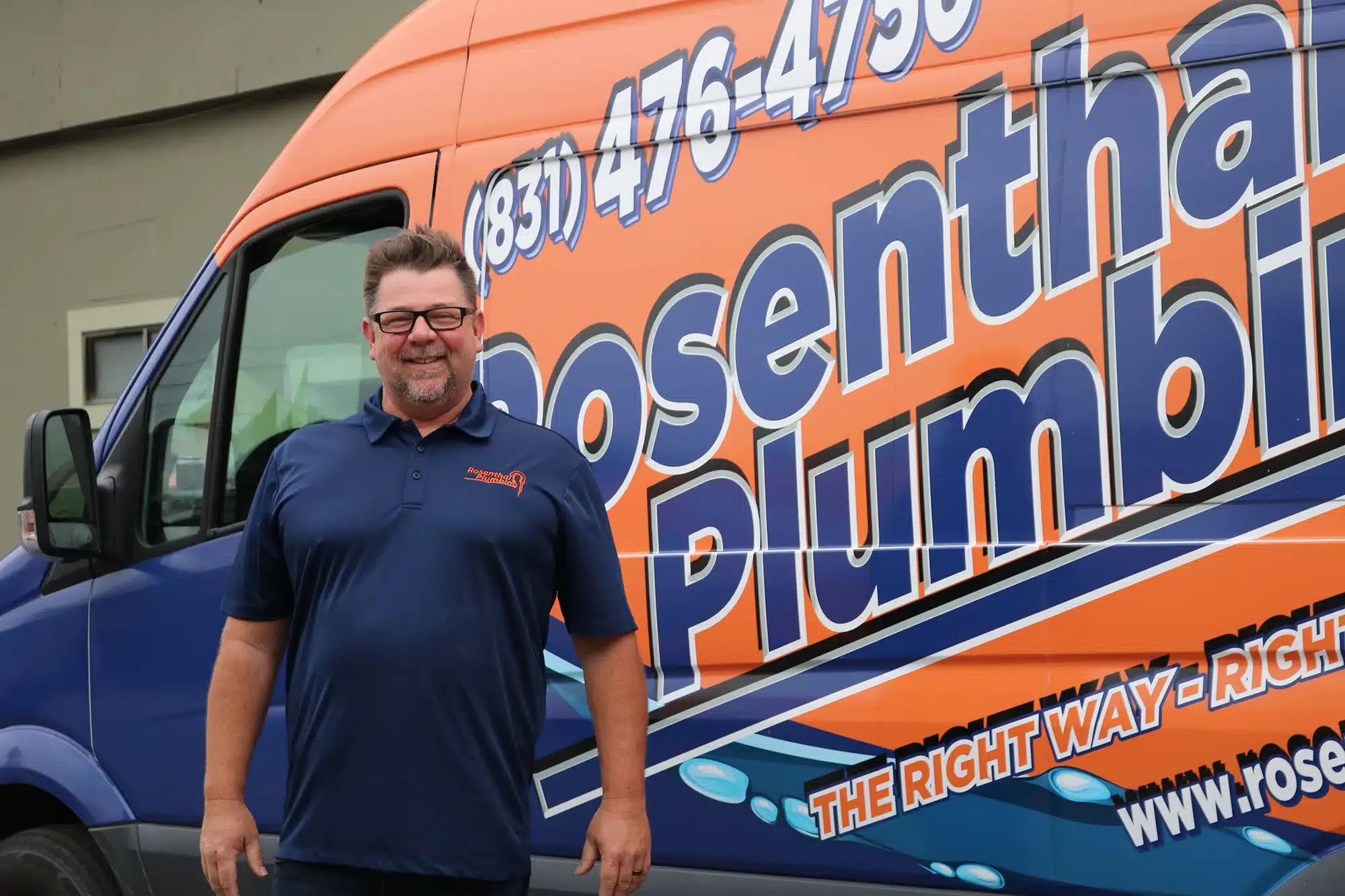 Rosenthal Plumbing owner in front of truck