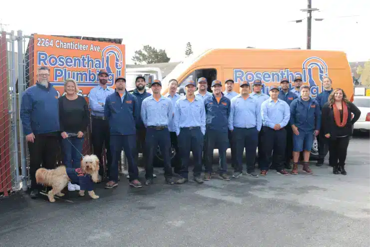 Rosenthal team in front of Rosenthal logo van and sign.